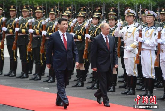 5月20日，中國國家主席習近平在上海舉行儀式歡迎俄羅斯總統(tǒng)普京訪華。中新社發(fā) 廖攀 攝